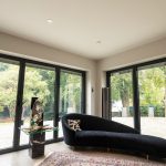 Doors from First Windows with black sofa